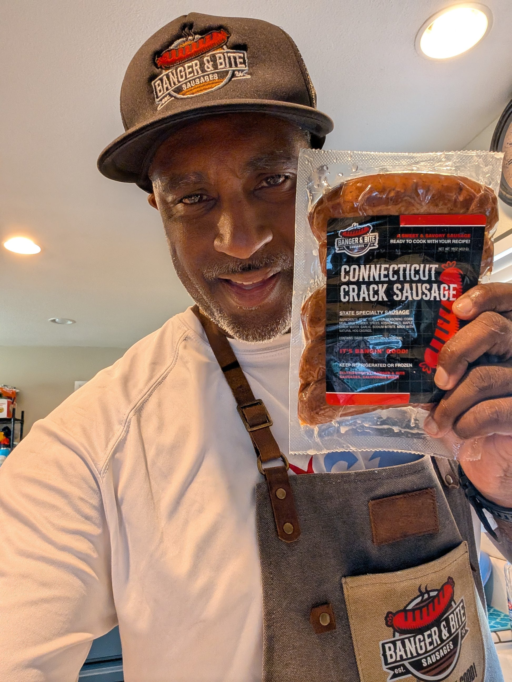 Our founder, Malcolm, holding up the pack, "Connecticut Crack Sausage"